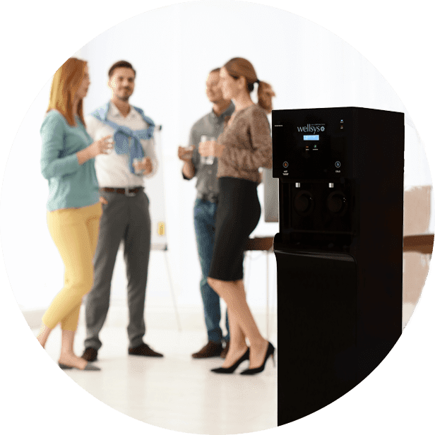 image-circle-1 copy Group of employees talking after refilling their water glass